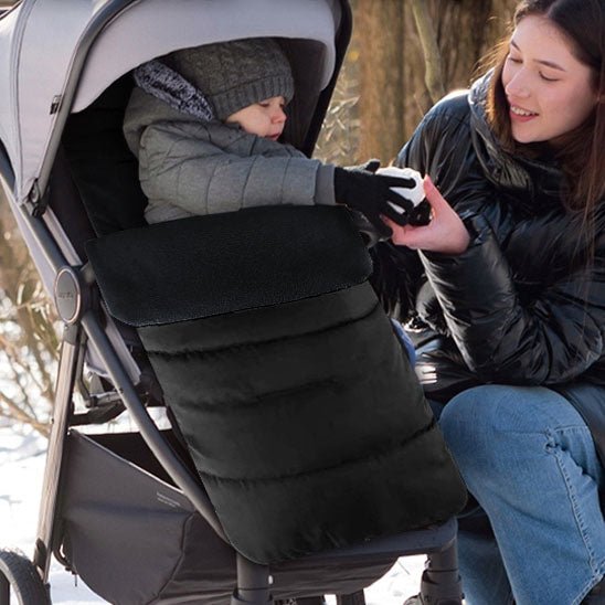 Maman avec bébé dans chanceliere noire confortable babyconfo