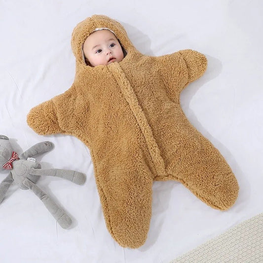 bébé couché dans nid dange bebe doux brun étoile